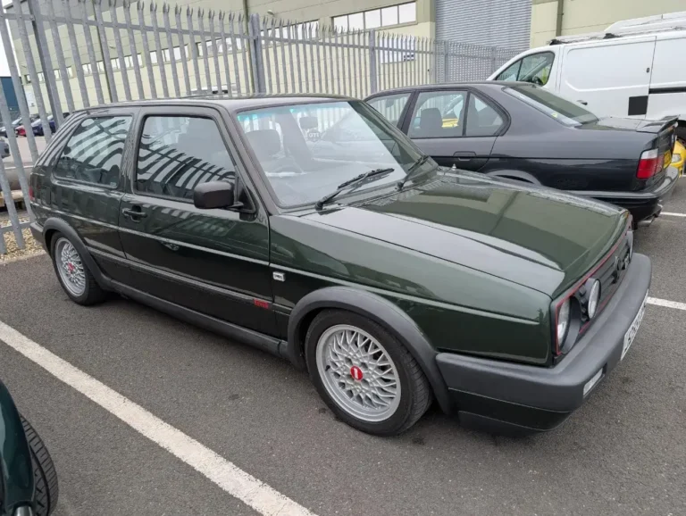 Classic Volkswagen Golf GTI in dark green after restoration work by Trickett Welding Ltd